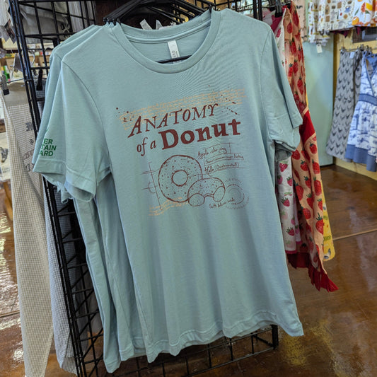 Light blue t-shirt with 'Anatomy of a Donut' design on a rack in a store.